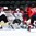 GRAND FORKS, NORTH DAKOTA - APRIL 14: LatviaÕs Roberts Kalkis #27 and Gustavs Grigals #29 battle with Switzerland's Marco Miranda #17 and Nico Hischier #13 in from of the net during preliminary round action at the 2016 IIHF Ice Hockey U18 World Championship. (Photo by Matt Zambonin/HHOF-IIHF Images)

